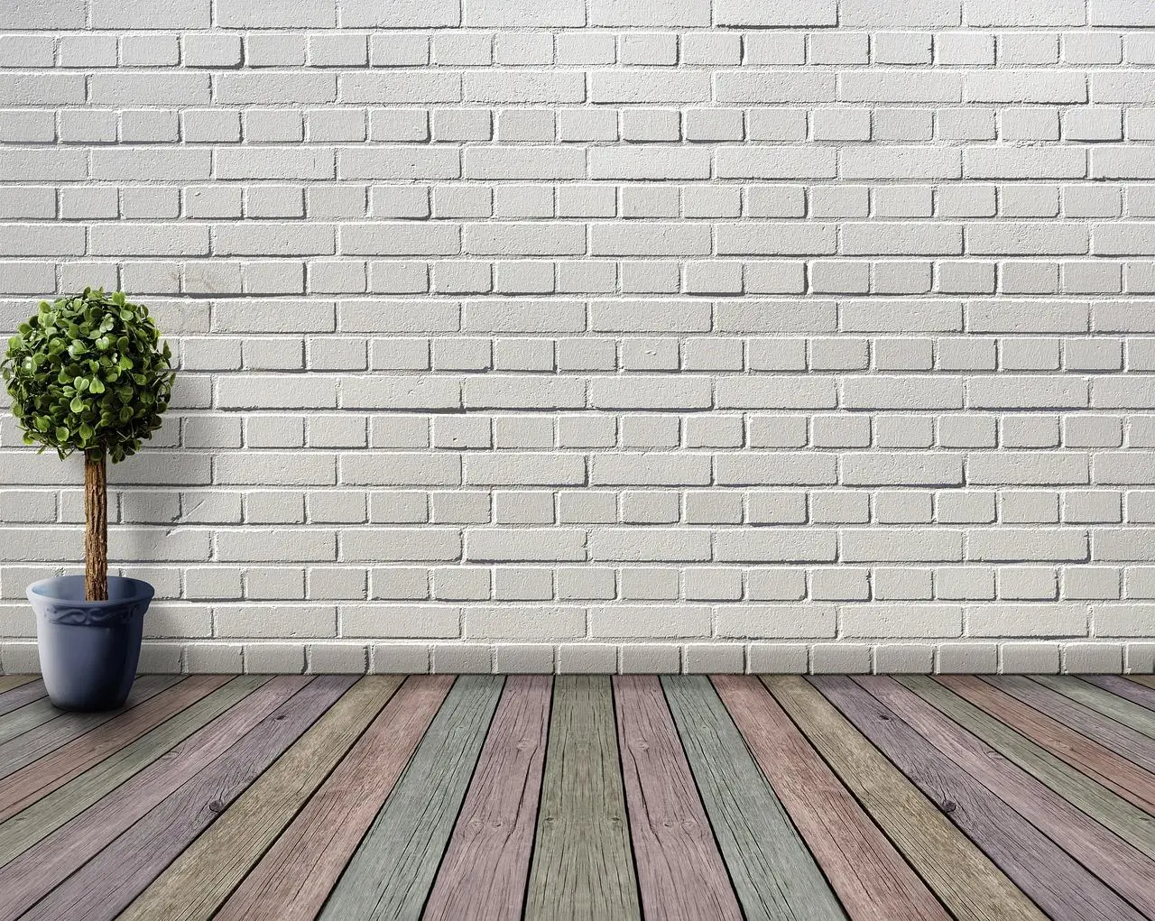 witte bakstenen muur kleurrijke houten vloer Met een bloempot aan de linkerkant van de kamer in Enschede